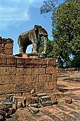 Angkor - Eastern Mebon - monolithic elephants at the corners of the platforms of the pyramid